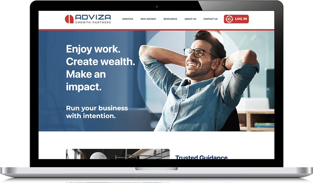 Smiling entrepreneur relaxing at desk, representing business growth and financial success with Adviza Growth Partners