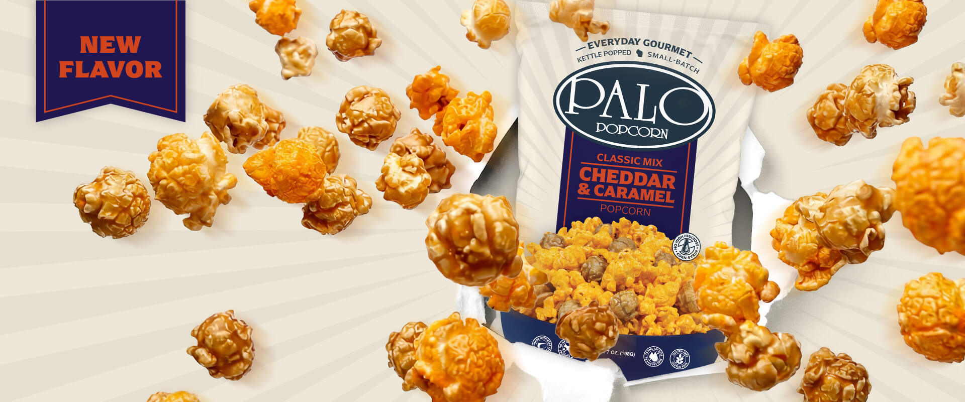 Palo Popcorn's new Cheddar and Caramel flavor bag surrounded by kettle-popped popcorn